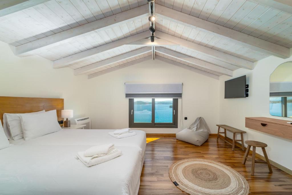 Ένα ή περισσότερα κρεβάτια σε δωμάτιο στο Smirties Villas