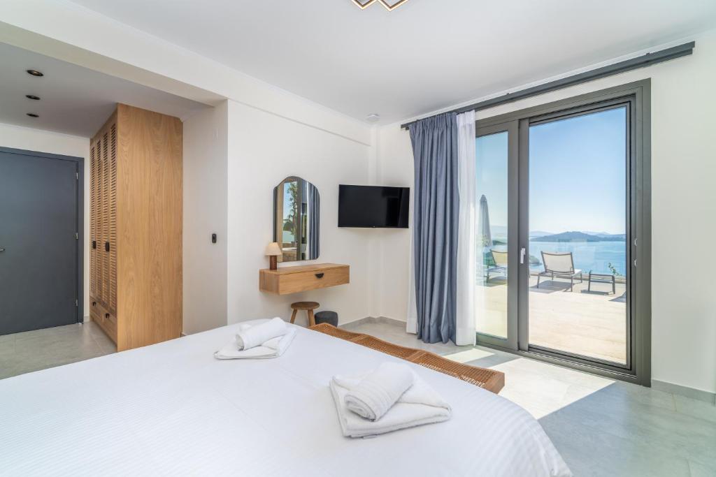 Ένα ή περισσότερα κρεβάτια σε δωμάτιο στο Smirties Villas