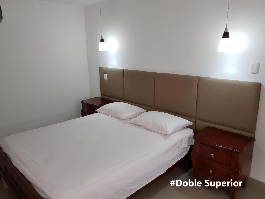 Una cama o camas en una habitación de Hotel Valledupar Plaza