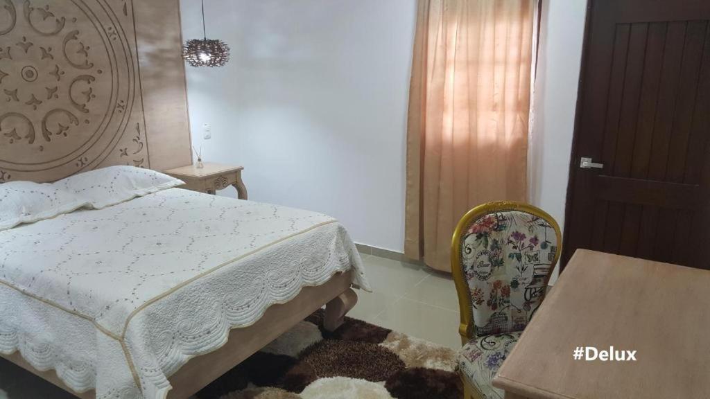 Una cama o camas en una habitación de Hotel Valledupar Plaza