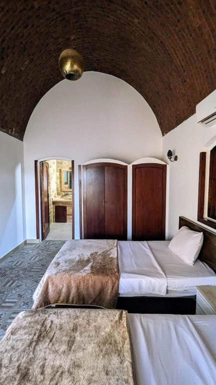Postel nebo postele na pokoji v ubytování Yasmine Guest House