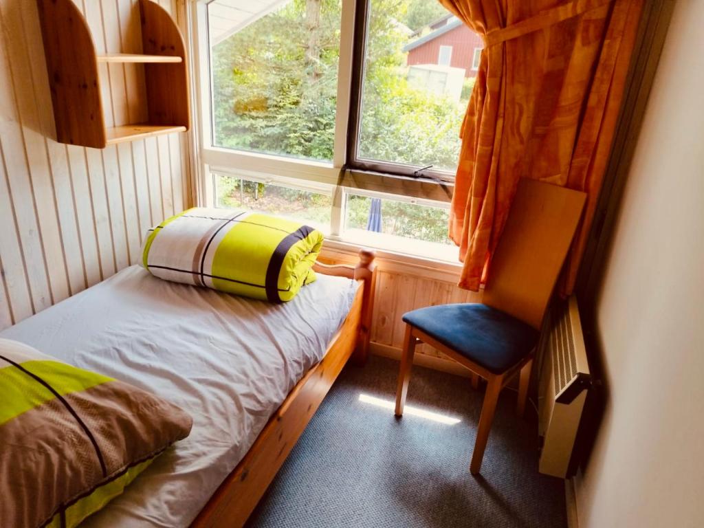 Postel nebo postele na pokoji v ubytování Extertal-Ferienpark - Premium Ferienhaus Sonnental - Sauna #50