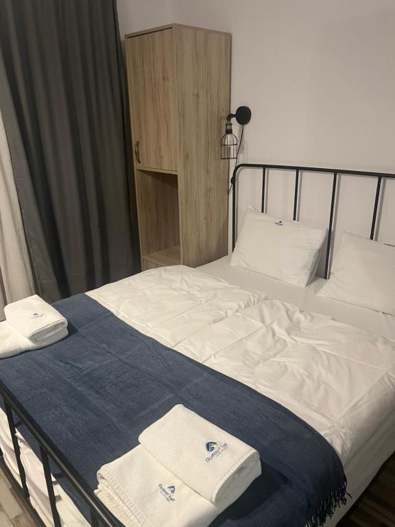 Postel nebo postele na pokoji v ubytování Gudauri Loft Apartment N508