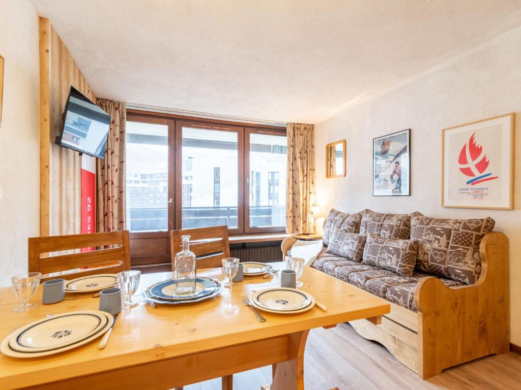 a living room with a table and a couch at Apartment Le Prariond-4 in Tignes