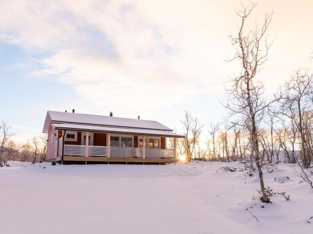 a house in the snow in the winter at Holiday Home Saana 3 by Interhome in Kilpisjärvi