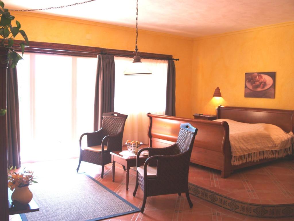Postel nebo postele na pokoji v ubytování Hotel Villa Lehmi