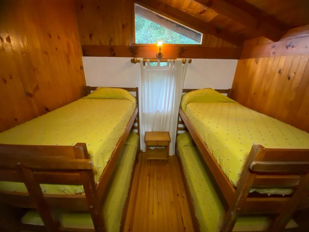 Postel nebo postele na pokoji v ubytování Cabañas Loncotraro