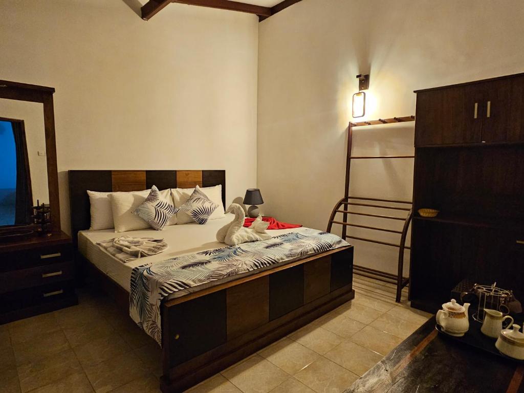Postel nebo postele na pokoji v ubytování Ellakanda Nature Villa