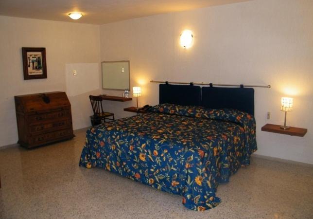 Postel nebo postele na pokoji v ubytování Parque Inn Hotel & Suites