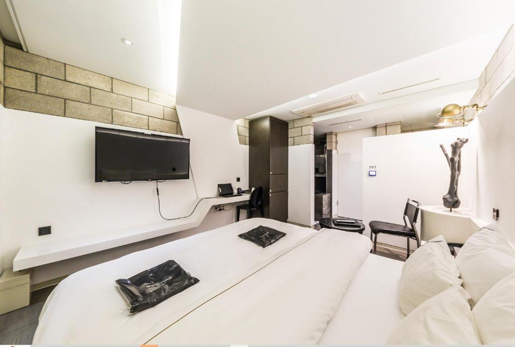 TV a/nebo společenská místnost v ubytování Hotel Cullinan Wangsimni