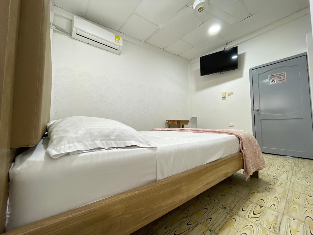 Postel nebo postele na pokoji v ubytování Hotel Balcon de Oro Curumani