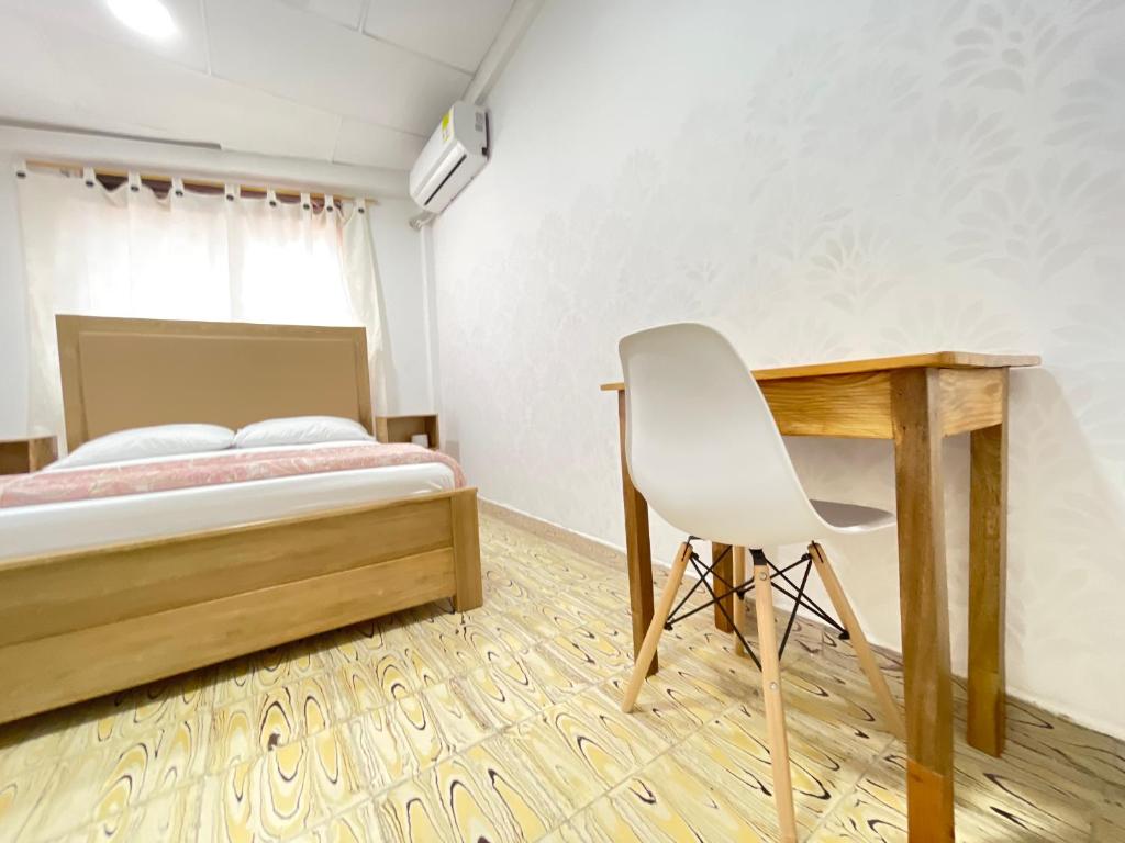 Postel nebo postele na pokoji v ubytování Hotel Balcon de Oro Curumani