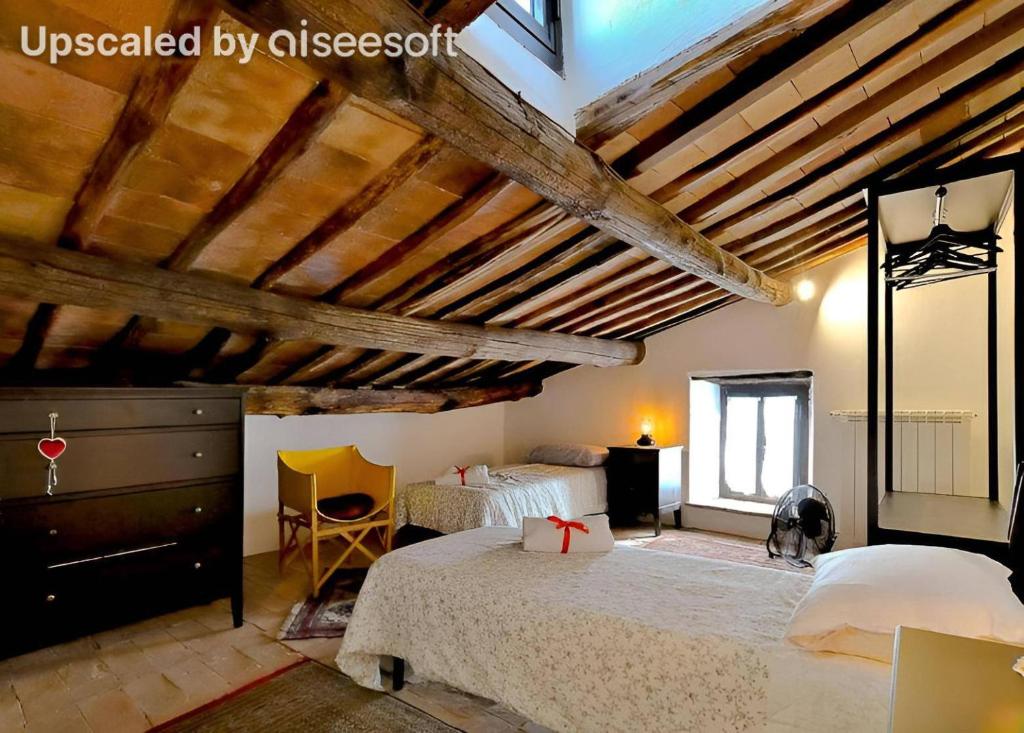 Postel nebo postele na pokoji v ubytování Palazzo Granaroli