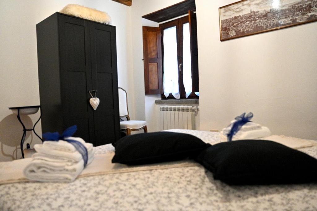 Postel nebo postele na pokoji v ubytování Palazzo Granaroli