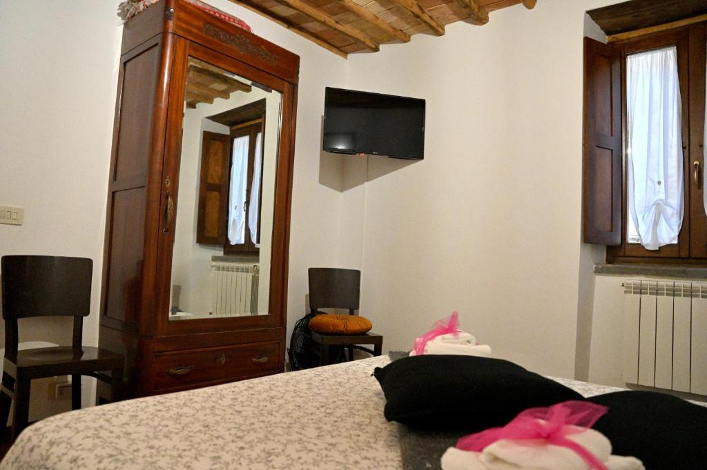 Postel nebo postele na pokoji v ubytování Palazzo Granaroli