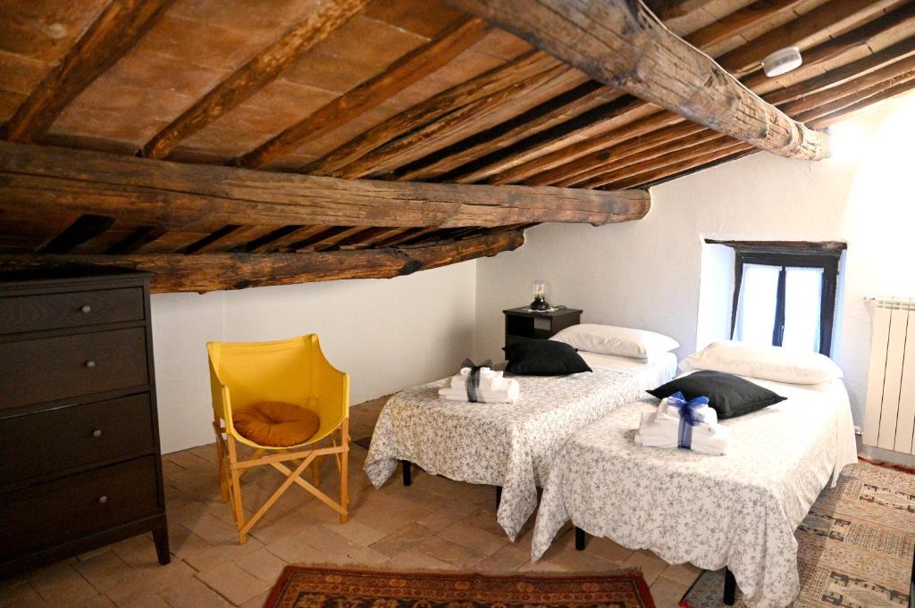 Postel nebo postele na pokoji v ubytování Palazzo Granaroli