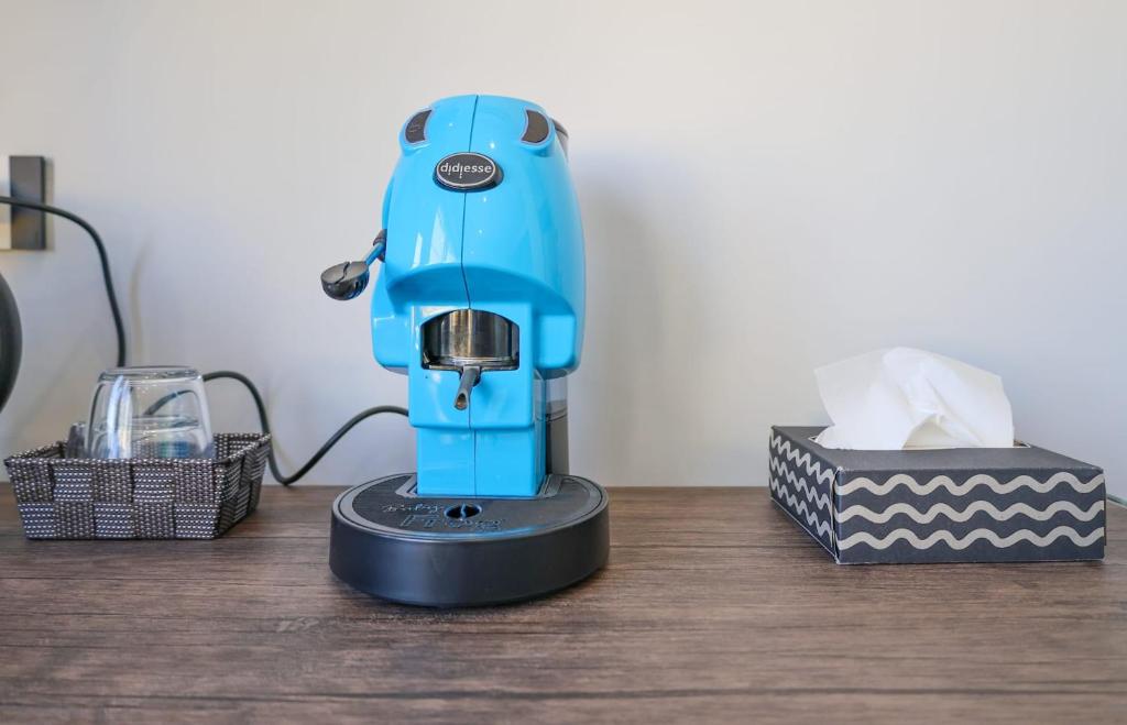 a blue sewing machine sitting on top of a table at Cuore Napoli Centro in Naples