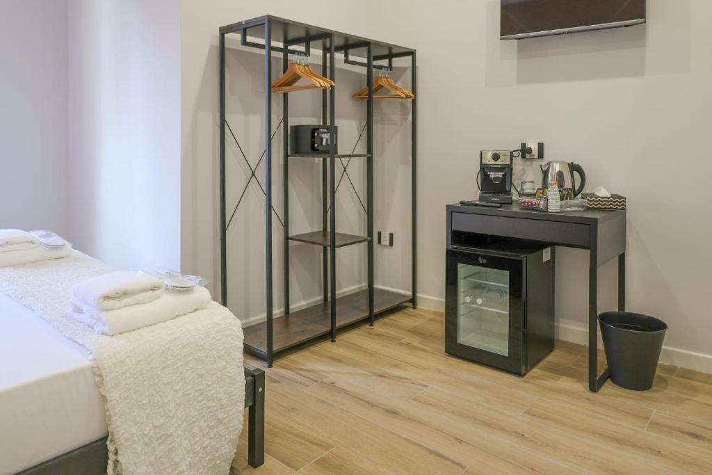 a room with a bed and a fireplace in it at Cuore Napoli Centro in Naples