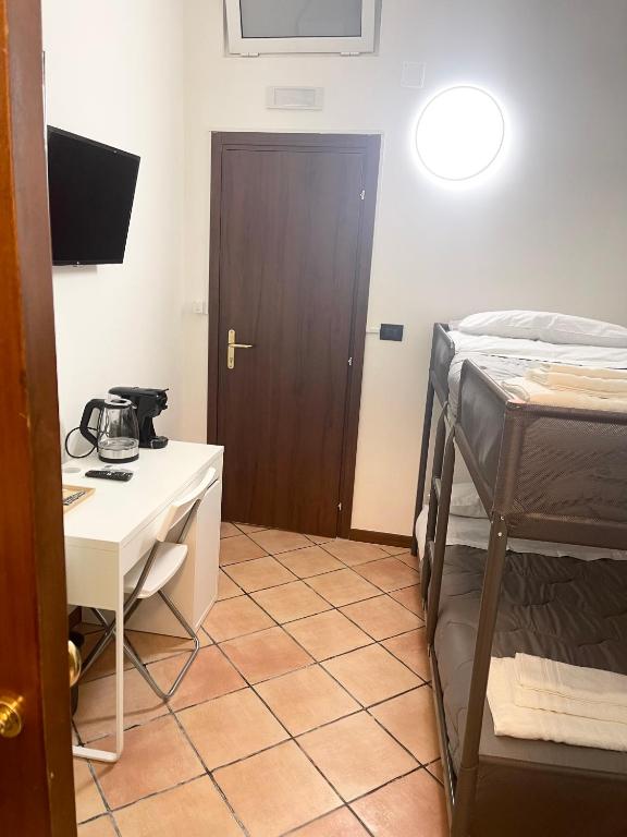 Postel nebo postele na pokoji v ubytování House Caracciolo by Loveinthetravel