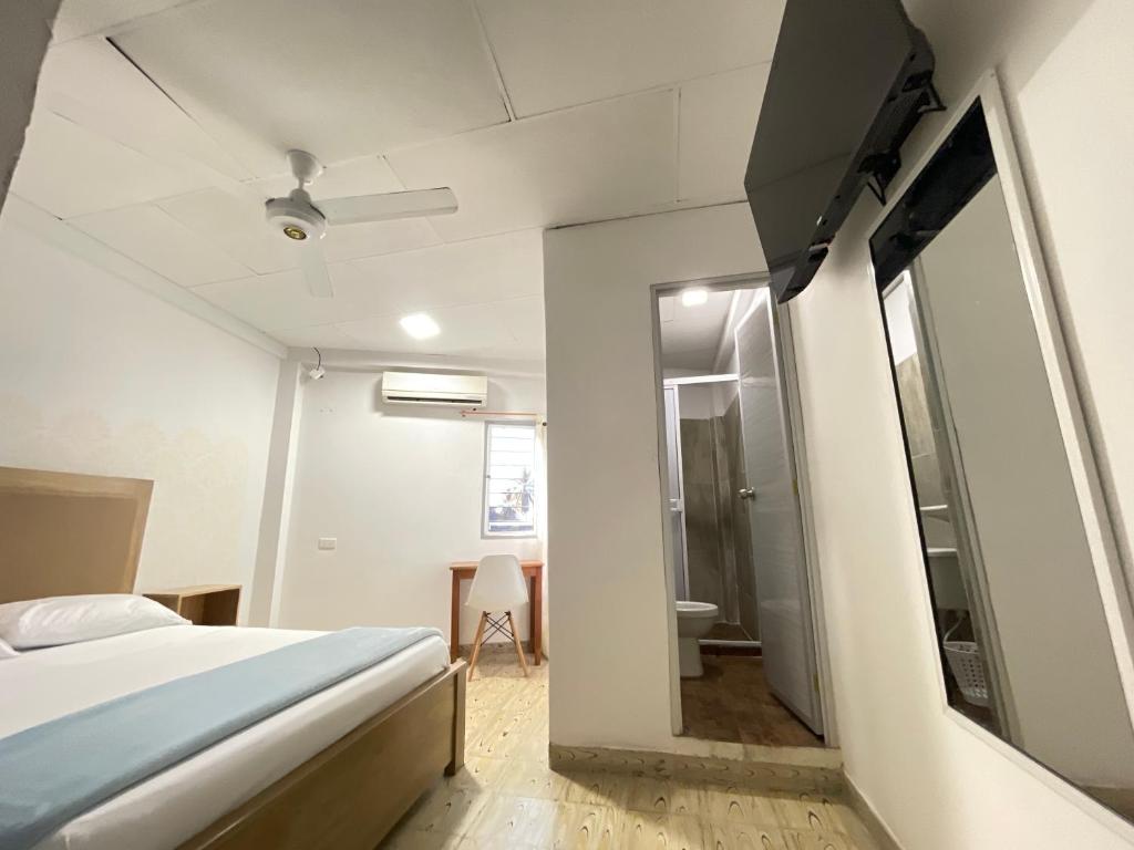 Postel nebo postele na pokoji v ubytování Hotel Balcon de Oro Curumani