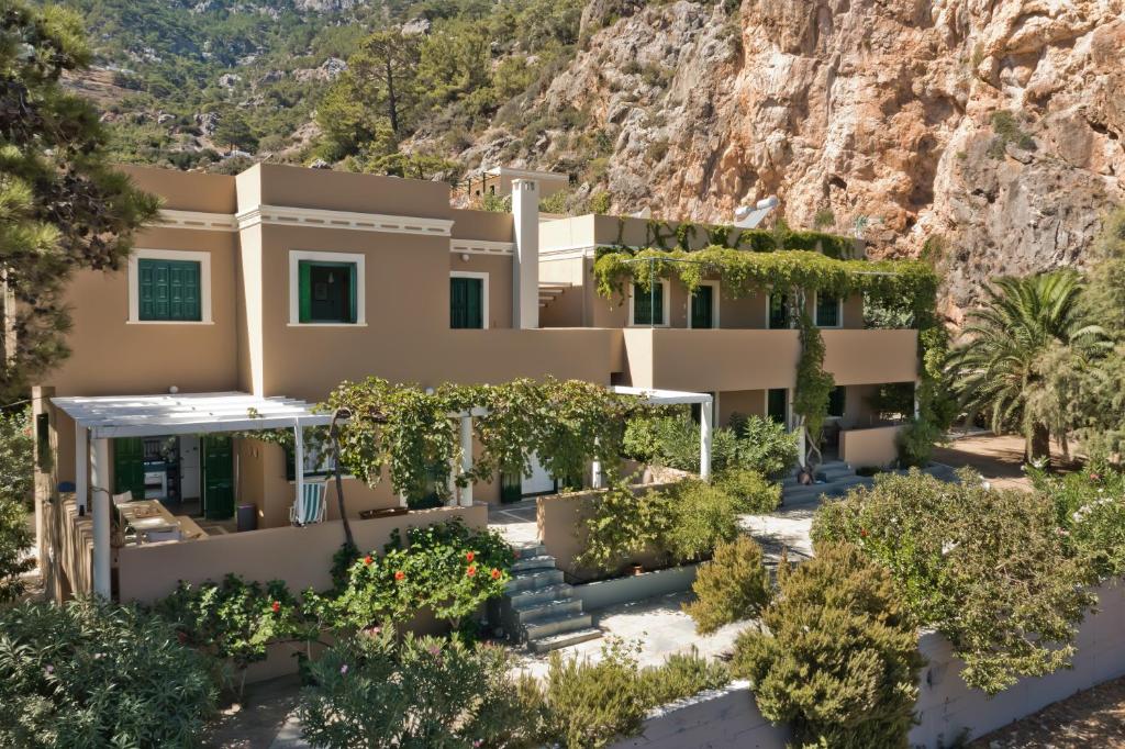 an aerial view of a house with a mountain at Rigò Apartments in Kyra Panagia