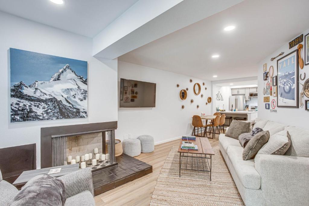a living room with a couch and a fireplace at Remodeled Vail Condo with Hot Tub Access! in Vail