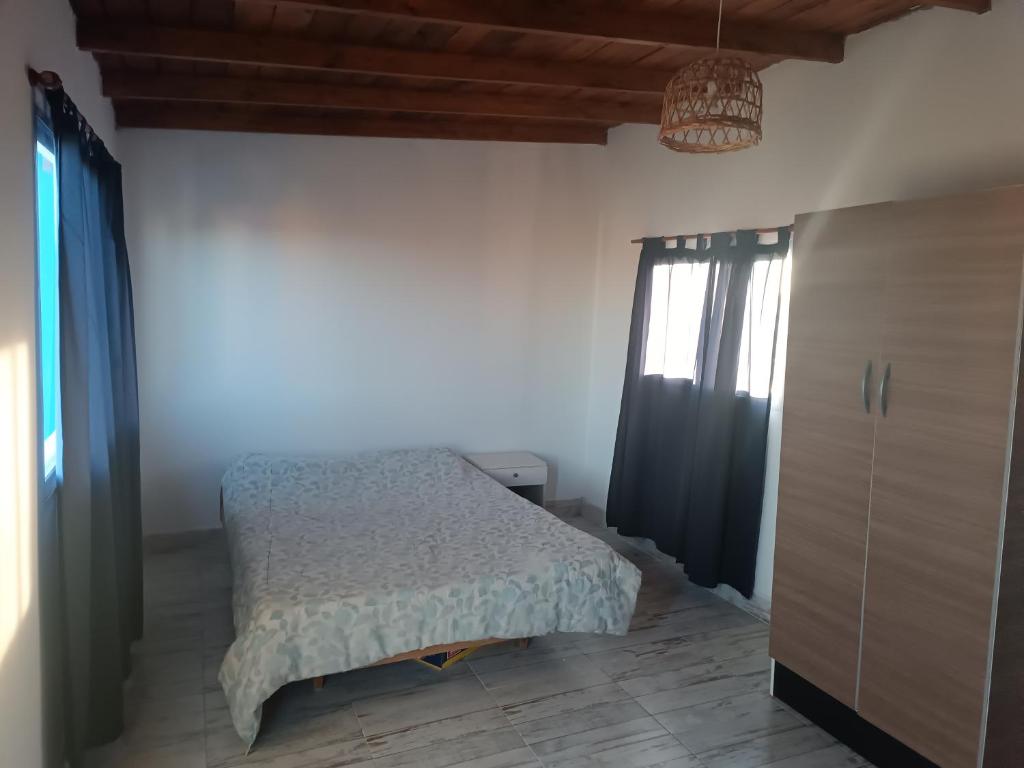 Ένα ή περισσότερα κρεβάτια σε δωμάτιο στο 2 Duplex camet norte santa clara del mar
