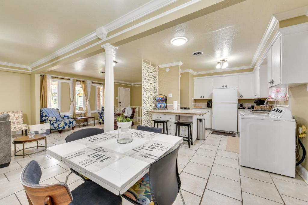 a kitchen and living room with a table and chairs at Baton Rouge Vacation Rental with Yard 10 Mi to LSU! in Baton Rouge
