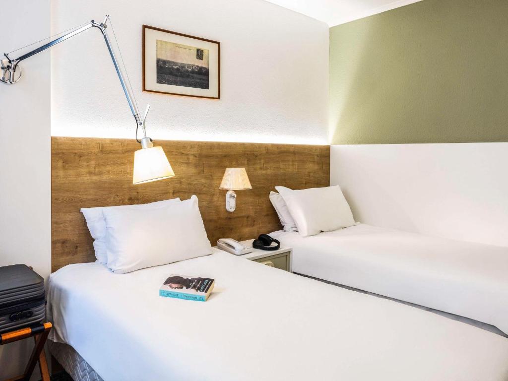 Postel nebo postele na pokoji v ubytování Mercure Hotel Forbach Centre de Loisirs