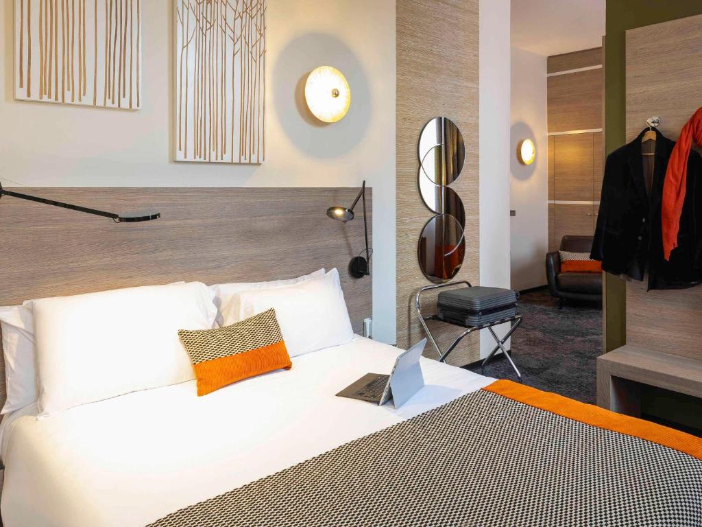 Postel nebo postele na pokoji v ubytování Mercure Hotel Forbach Centre de Loisirs