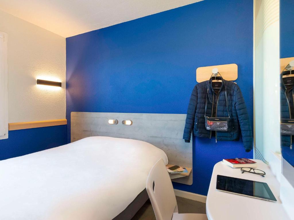 Postel nebo postele na pokoji v ubytování ibis budget Saint-Maximin