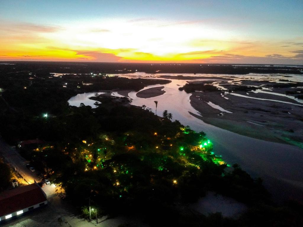 an aerial view of a river at night at Ciamat Camp in Santo Amaro