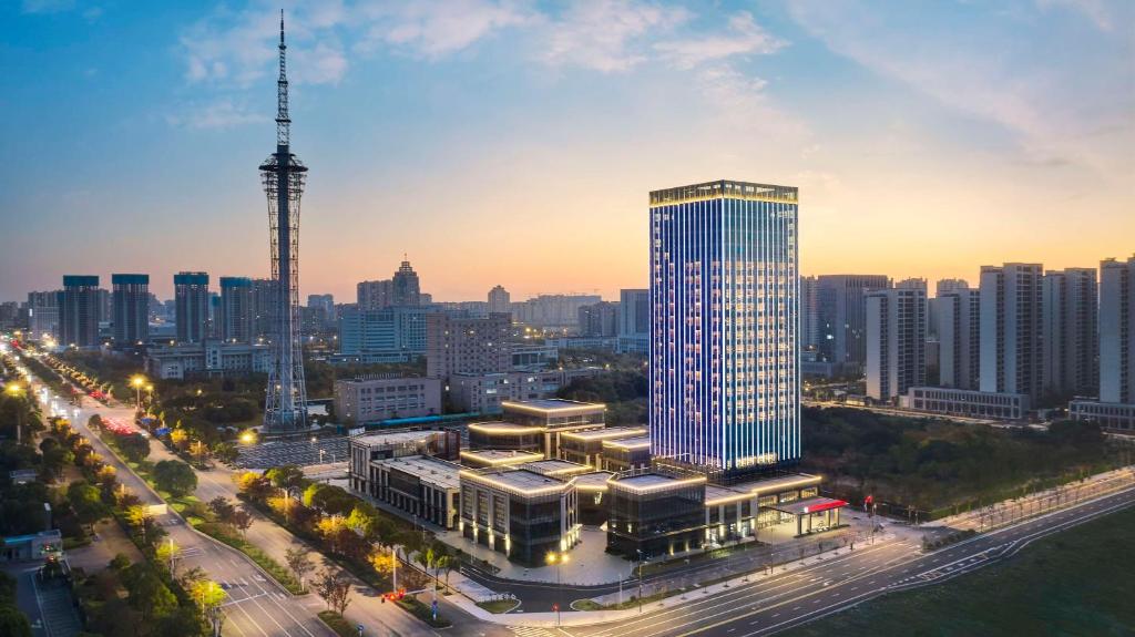 a view of a city with a tall building at Hilton Garden Inn Nantong Rudong in Nantong