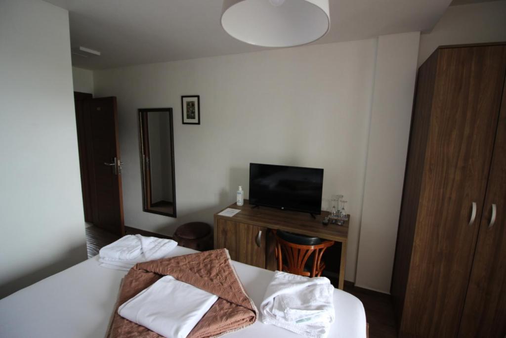 Postel nebo postele na pokoji v ubytování Hotel La Terrazza