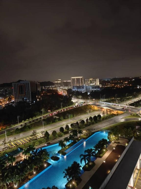 a view of a city at night at MFA Putrajaya Homestay in Putrajaya