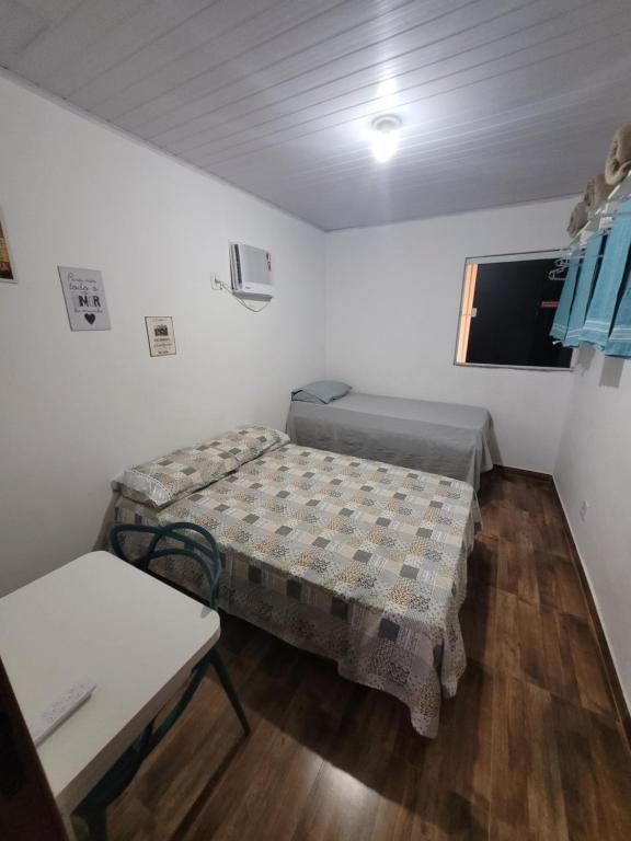 Cama o camas de una habitación en Moradas São Cristovão - VILA 57