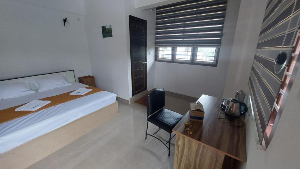 Postel nebo postele na pokoji v ubytování Karthika Homes
