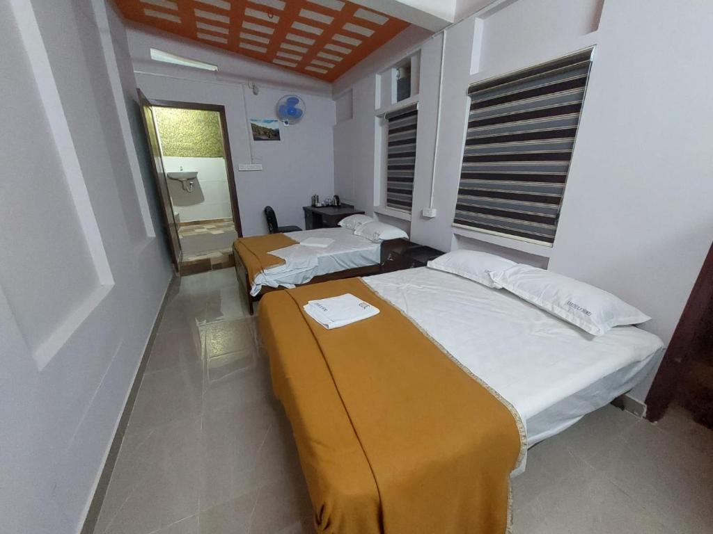 Postel nebo postele na pokoji v ubytování Karthika Homes