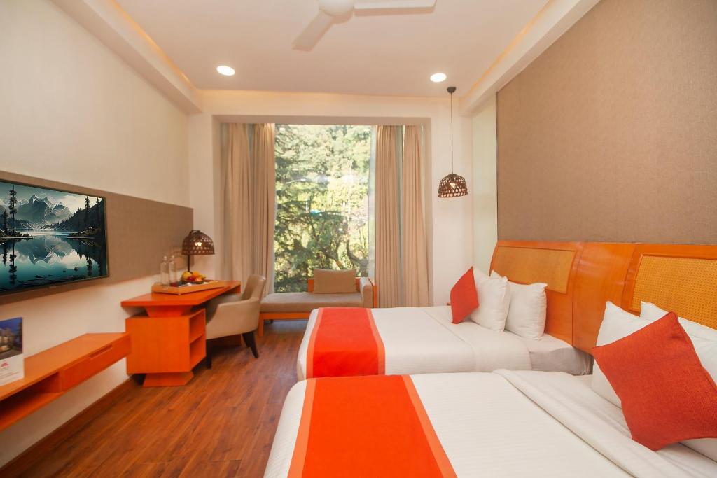 Postel nebo postele na pokoji v ubytování Yog Wellness Resort & Spa By Amritara