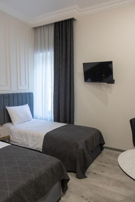 Postel nebo postele na pokoji v ubytování Parvana Guest House