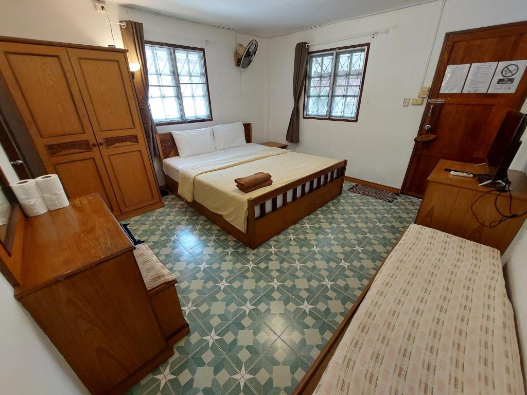Postel nebo postele na pokoji v ubytování Fullmoon House Samui