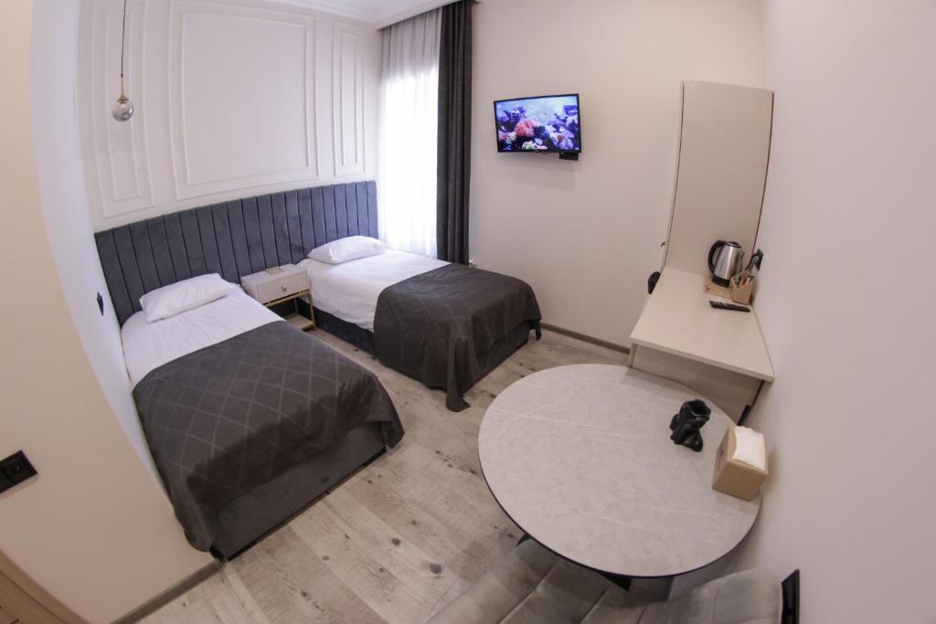 Postel nebo postele na pokoji v ubytování Parvana Guest House