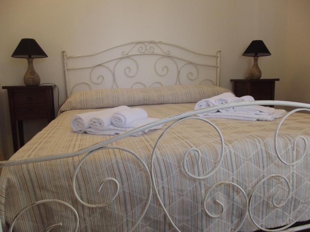 Postel nebo postele na pokoji v ubytování Agriturismo Zio Zac