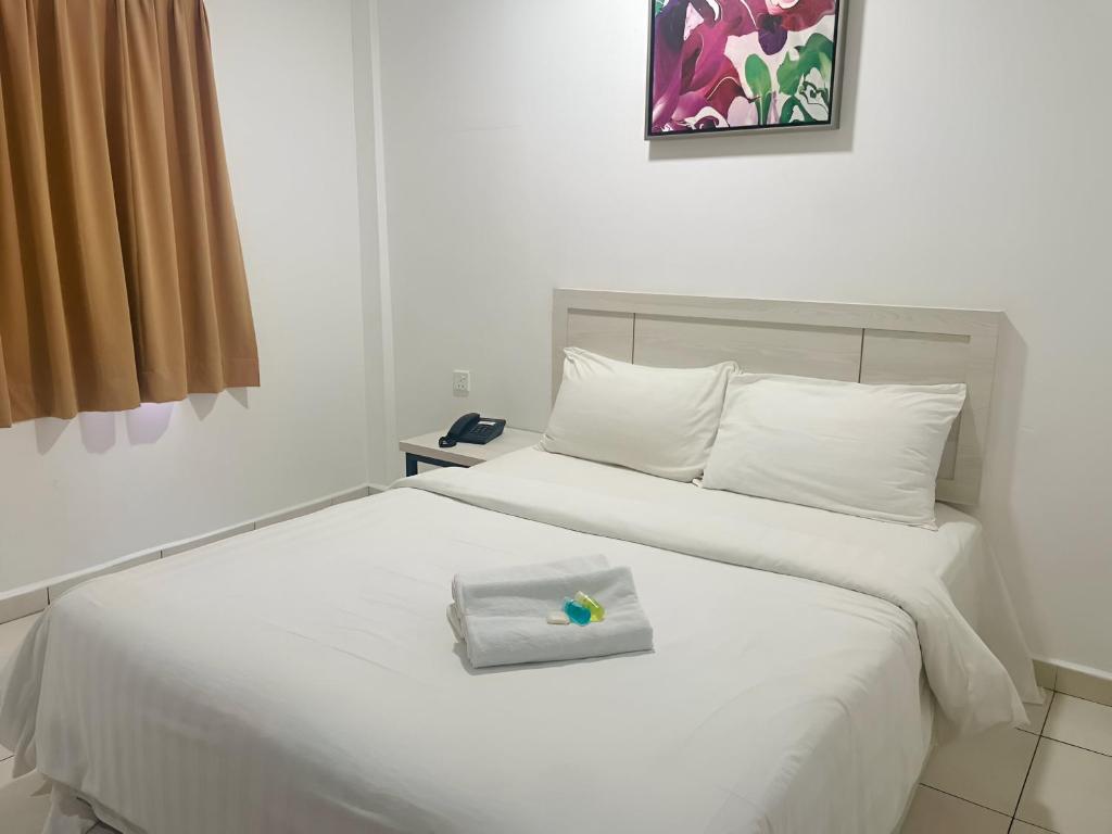 Postel nebo postele na pokoji v ubytování De Ocean Hotel