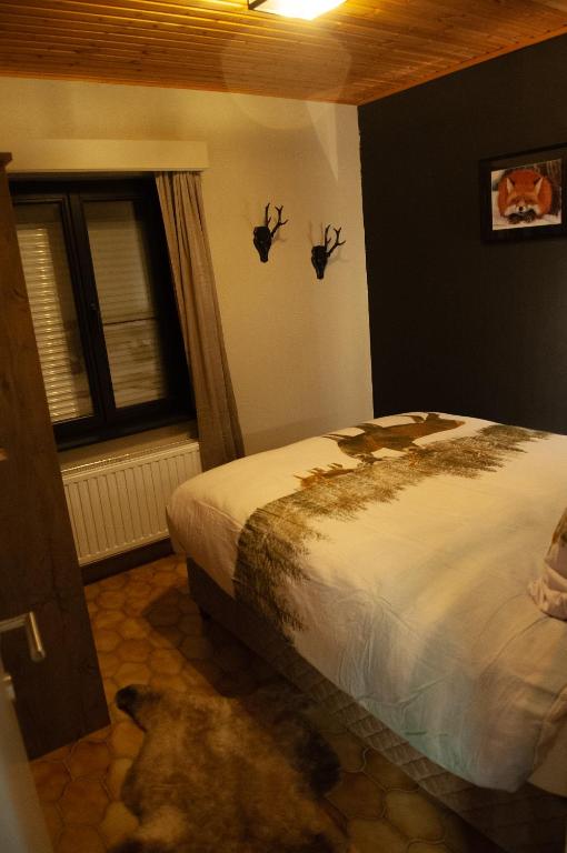 Postel nebo postele na pokoji v ubytování Le Petit Erezée