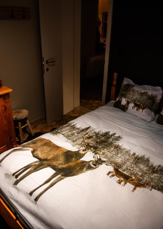 Postel nebo postele na pokoji v ubytování Le Petit Erezée