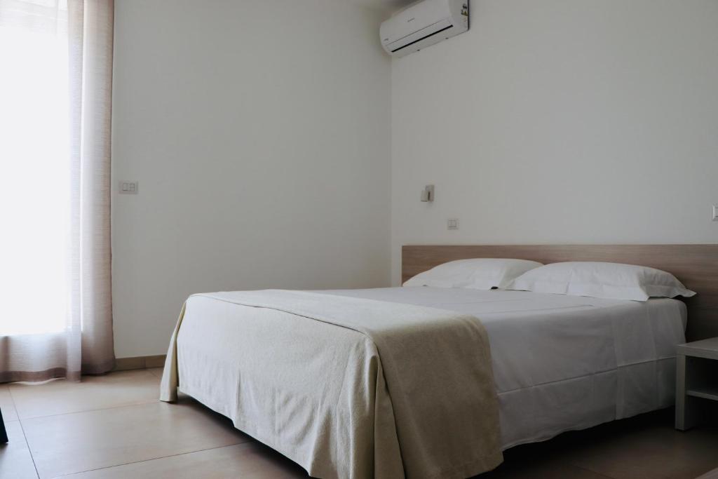 Posteľ alebo postele v izbe v ubytovaní Verde Blu Vacanze B&B