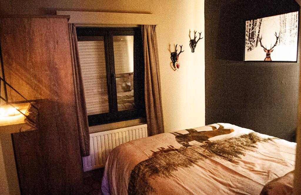 Postel nebo postele na pokoji v ubytování Le Petit Erezée