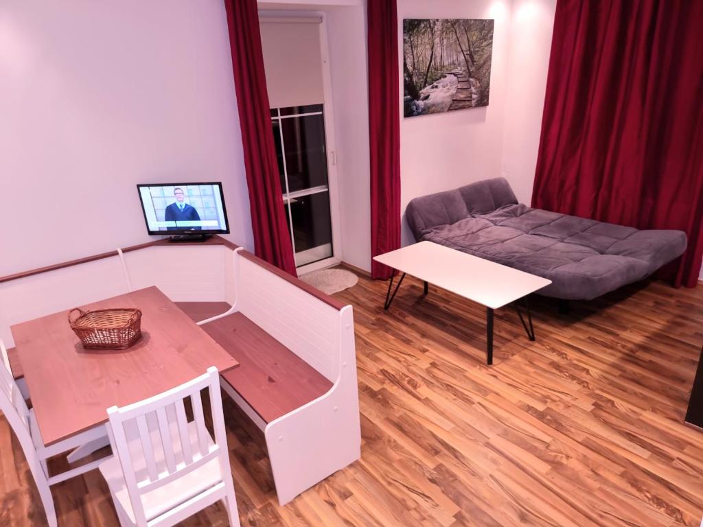 TV a/nebo společenská místnost v ubytování Rentcenter79_2