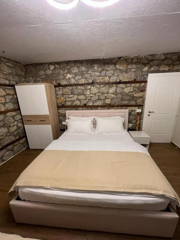 Postel nebo postele na pokoji v ubytování Vila Ndrio
